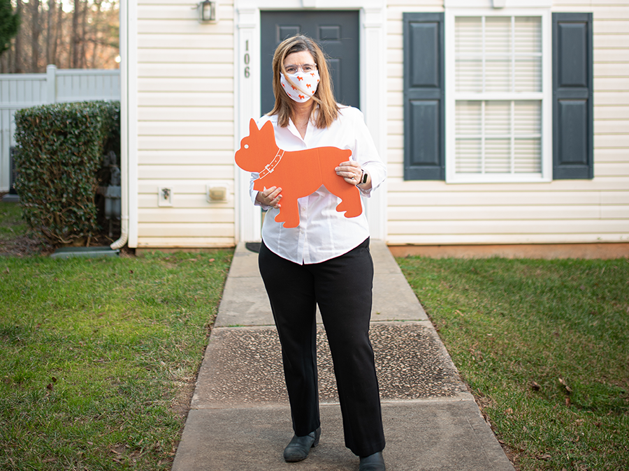 woman holding luke sign